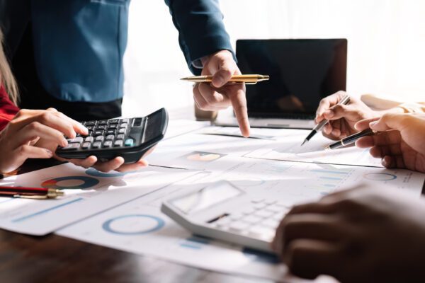 business team reviewing and analysis a diagram or chart and financial reports for a return on investment or investment risk analysis or business performance